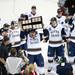 Notre Dame junior Anders Lee lifts the trophy and celebrates with his team after beating Michigan 3-1 on Sunday, March 24. Daniel Brenner I AnnArbor.com